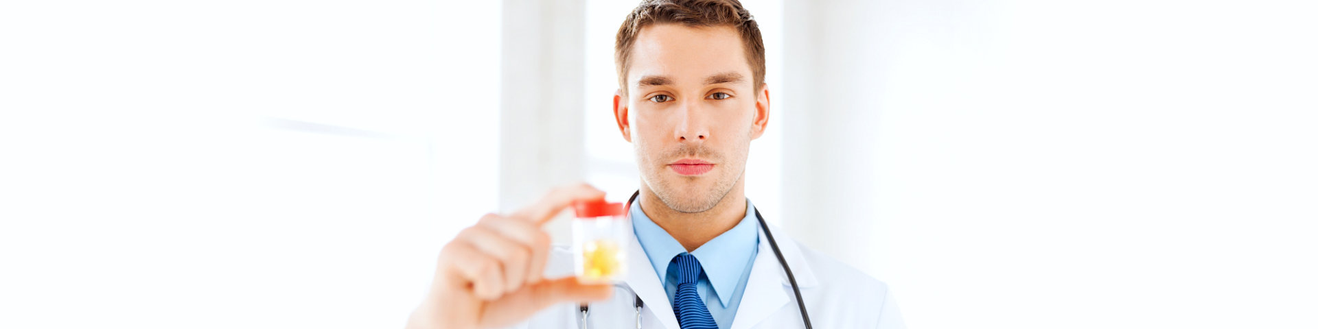 doctor holding a medicine in a container